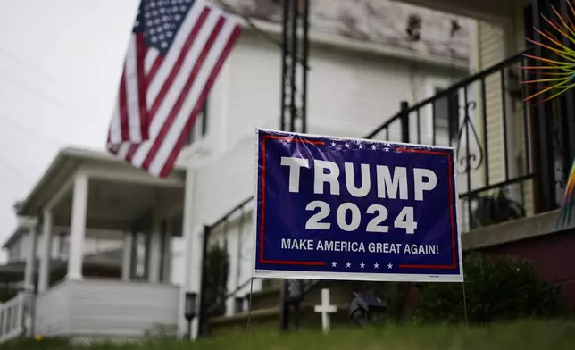 A sign supporting Republican presidential nominee former President Donald Trump is posted in Jim Hulings, chairman of the Butler County Republican Committee yard in Zelienople, Thursday, Sept. 26, 2024. (AP Photo/Matt Rourke)