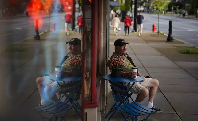 Jim Perry who witnessed an assassination attempt against Republican presidential nominee former President Donald Trump, plans to attend an upcoming rally, sits outside Cummings Candy &amp; Coffee in Butler, Saturday, Sept. 28, 2024. (AP Photo/Matt Rourke)