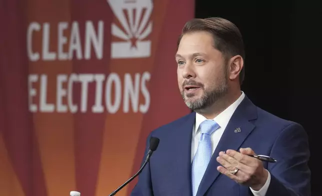 U.S. Senate candidate U.S. Rep. Ruben Gallego, D-Ariz., speaks during a debate with Republican challenger Kari Lake, Wednesday, Oct. 9, 2024, in Phoenix. (Cheryl Evans/Arizona Republic via AP)