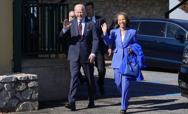 President Joe Biden, left, walks with Rep. Lisa Blunt Rochester, D-Del., after having breakfast at The Legend Restaurant &amp; Bakery, Monday, Oct. 28, 2024, in New Castle, Del. (AP Photo/Manuel Balce Ceneta)