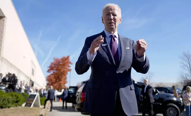 President Joe Biden speaks with reporters after casting his early-voting ballot for the 2024 general elections, Monday, Oct. 28, 2024, at a polling station in New Castle, Del. (AP Photo/Manuel Balce Ceneta)