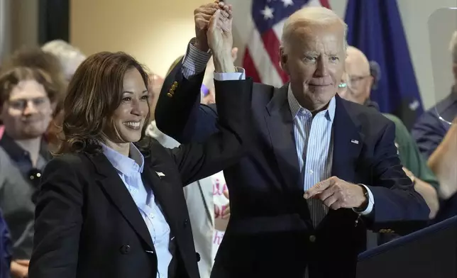 FILE - Democratic presidential nominee Vice President Kamala Harris, left, and President Joe Biden attend a campaign event at the IBEW Local Union #5 union hall in Pittsburgh, on Labor Day, Sept. 2, 2024. (AP Photo/Jacquelyn Martin, File)