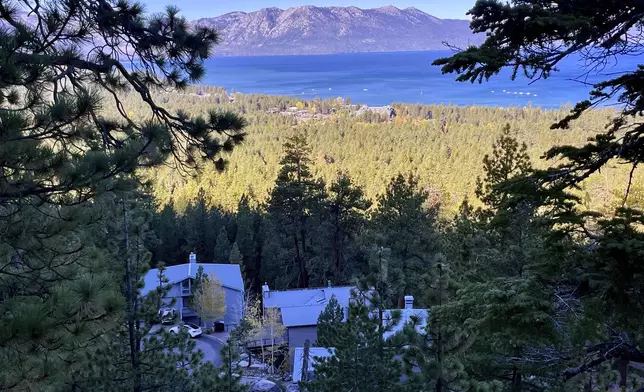 Homes are seen on a mountain overlooking South Lake Tahoe, Calif, on Friday, Oct. 18, 2024, where voters will decide whether to approve Measure N, which will mandate a tax to homeowners who leave their homes vacant for more than half the year. (AP Photo/Haven Daley)