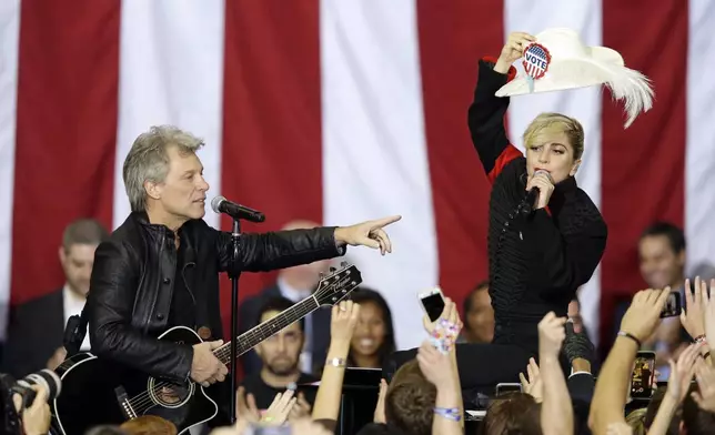 FILE - Jon Bon Jovi and Lady Gaga perform during a campaign rally for Democratic presidential candidate Hillary Clinton in Raleigh, N.C., Nov. 8, 2016. (AP Photo/Gerry Broome, File)