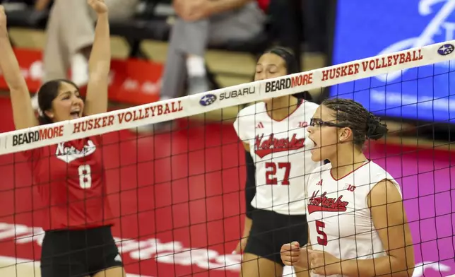 FILE - Nebraska's Rebekah Allick (5) celebrates a kill against Iowa during the first set of a college volleyball match, Sunday, Oct. 6, 2024, at the Devaney Center in Lincoln, Neb. (Nikos Frazier/Omaha World-Herald via AP, File)