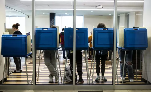 FILE - Voters fill out their ballots in booths on Election Day, Tuesday, Nov. 8, 2022, at Petersen Residence Hall on the University of Iowa campus in Iowa City, Iowa. (Joseph Cress/Iowa City Press-Citizen via AP, File)