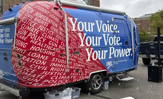 FILE - A 19-foot Airstream Caravel on loan to the League of Women Voters of Ohio visits the main campus of the Ohio State University in Columbus, Ohio, Thursday, Sept. 26, 2024, as the group works to register and engage student voters. (AP Photo/Julie Carr Smyth, File)