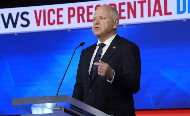 Democratic vice presidential nominee Minnesota Gov. Tim Walz speaks during a vice presidential debate hosted by CBS News, with Republican vice presidential nominee Sen. JD Vance, R-Ohio, Tuesday, Oct. 1, 2024, in New York. (AP Photo/Matt Rourke)