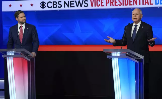 Democratic vice presidential nominee Minnesota Gov. Tim Walz speaks during a vice presidential debate hosted by CBS News, with Republican vice presidential nominee Sen. JD Vance, R-Ohio, Tuesday, Oct. 1, 2024, in New York. (AP Photo/Matt Rourke)