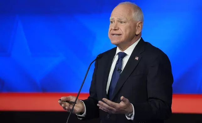 Democratic vice presidential nominee Minnesota Gov. Tim Walz speaks during a vice presidential debate hosted by CBS News, with Republican vice presidential nominee Sen. JD Vance, R-Ohio, Tuesday, Oct. 1, 2024, in New York. (AP Photo/Matt Rourke)