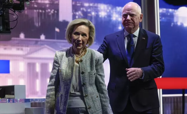 Democratic vice presidential candidate Minnesota Gov. Tim Walz and his wife Gwen Walz walk from stage after a vice presidential debate with Republican vice presidential nominee Sen. JD Vance, R-Ohio, hosted by CBS News, Tuesday, Oct. 1, 2024, in New York. (AP Photo/Matt Rourke)