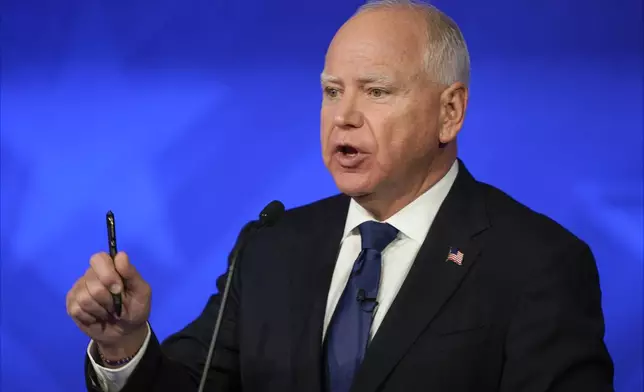 Democratic vice presidential nominee Minnesota Gov. Tim Walz speaks during a vice presidential debate hosted by CBS News, with Republican vice presidential nominee Sen. JD Vance, R-Ohio, Tuesday, Oct. 1, 2024, in New York. (AP Photo/Matt Rourke)