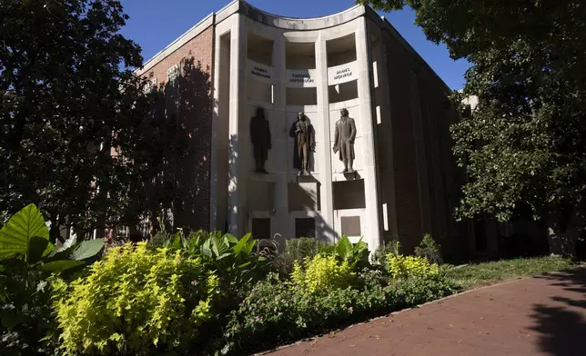 Statues of James Madison, Thomas Jefferson and James Monroe are seen at the city hall Oct. 10, 2024, in Charlottesville, Va. (AP Photo/Serkan Gurbuz)