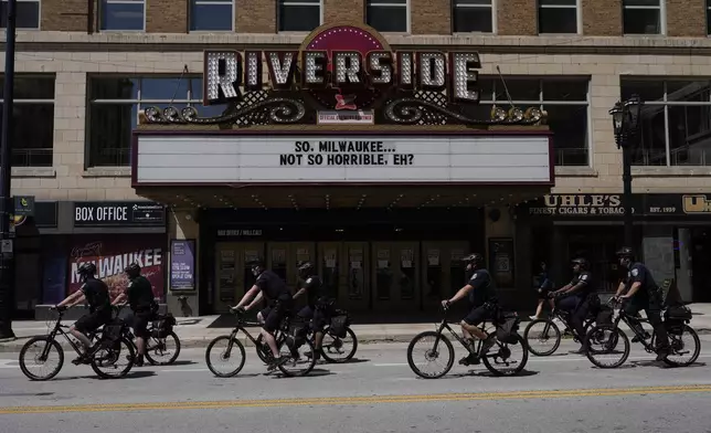 FILE - Police officers ride bikes around outside of the Republican National Convention area July 18, 2024, in Milwaukee. (AP Photo/Jae C. Hong, File)