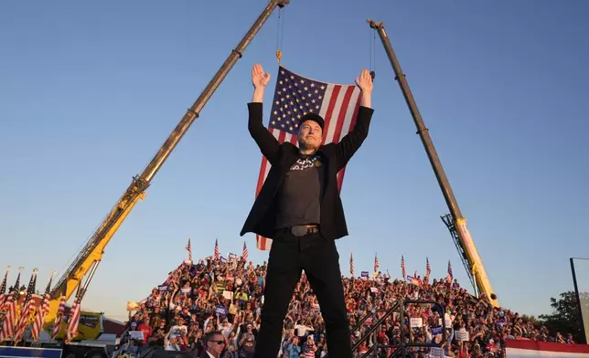 FILE - Tesla and SpaceX CEO Elon Musk walks to the stage to speak alongside Republican presidential nominee former President Donald Trump at a campaign event at the Butler Farm Show, Saturday, Oct. 5, 2024, in Butler, Pa. (AP Photo/Alex Brandon, File)