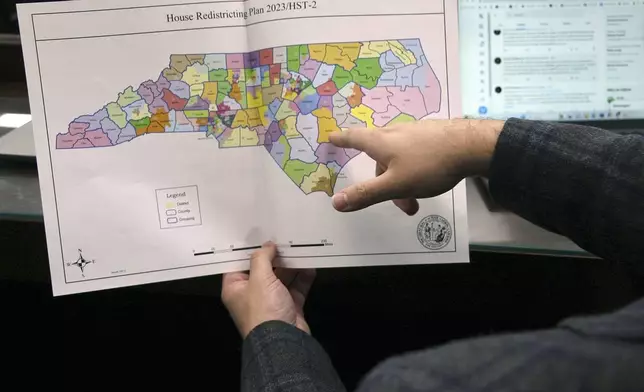 FILE - The North Carolina state House reviews copies of a map proposal for new state House districts during a committee hearing at the Legislative Office Building in Raleigh, N.C., Thursday, Oct. 19, 2023. (AP Photo/Hannah Schoenbaum, File)