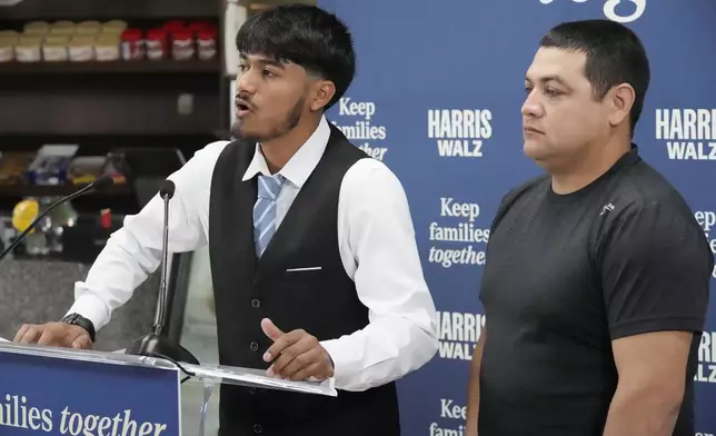 FILE - Billy and his father, no last name given, speak at a Democratic Party campaign event, about their experience of being separated when they crossed the U.S.- Mexico border during the Trump administration, Oct. 16, 2024, in Doral, Fla. (AP Photo/Marta Lavandier, File)