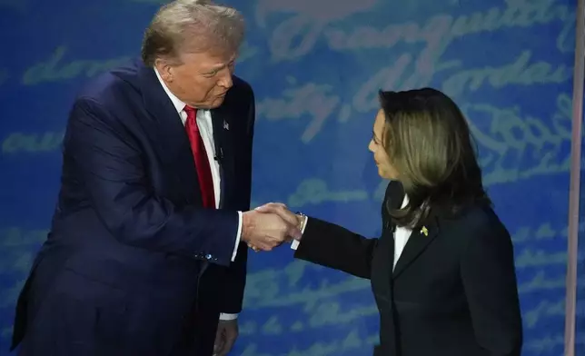 FILE - Republican presidential nominee former President Donald Trump and Democratic presidential nominee Vice President Kamala Harris shake hands before the start of an ABC News presidential debate at the National Constitution Center, Sept. 10, 2024, in Philadelphia. (AP Photo/Alex Brandon, File)