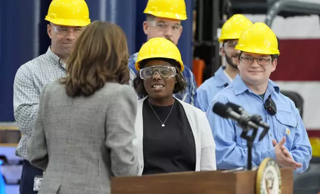 Employees listen as Democratic presidential nominee Vice President Kamala Harris speaks after touring the Hemlock Semiconductor Next-Generation Finishing facility in Hemlock, Mich., Monday, Oct. 28, 2024. (AP Photo/Jacquelyn Martin)