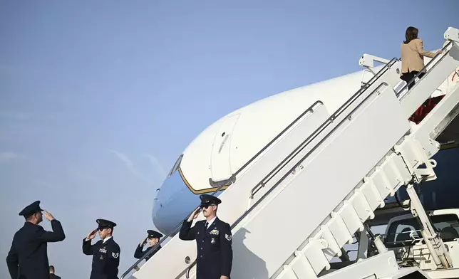 Democratic presidential nominee Vice President Kamala Harris boards Air Force Two at Joint Base Andrews, Md., Saturday, Oct. 12, 2024, en route to North Carolina for a campaign event. (Brendan Smialowski/Pool via AP)