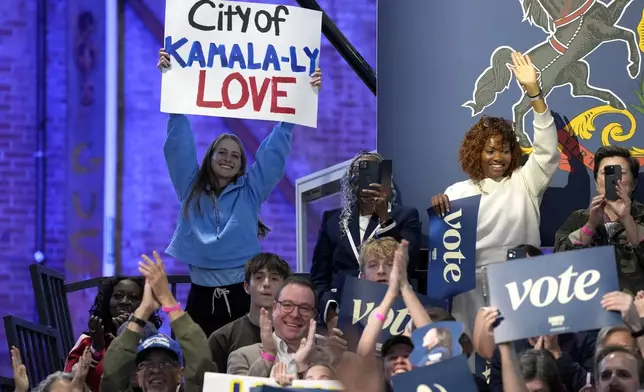 Supporters hold up signs at a community rally with Democratic presidential nominee Vice President Kamala Harris at the Alan Horwitz "Sixth Man" Center, Sunday, Oct. 27, 2024, in Philadelphia. (AP Photo/Susan Walsh)