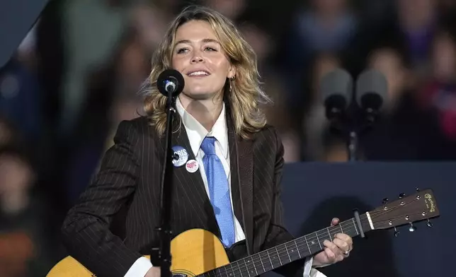 Maggie Rogers performs at a campaign event for Democratic presidential nominee Vice President Kamala Harris in Burns Park Monday, Oct. 28, 2024, in Ann Arbor, Mich. (AP Photo/Carlos Osorio)