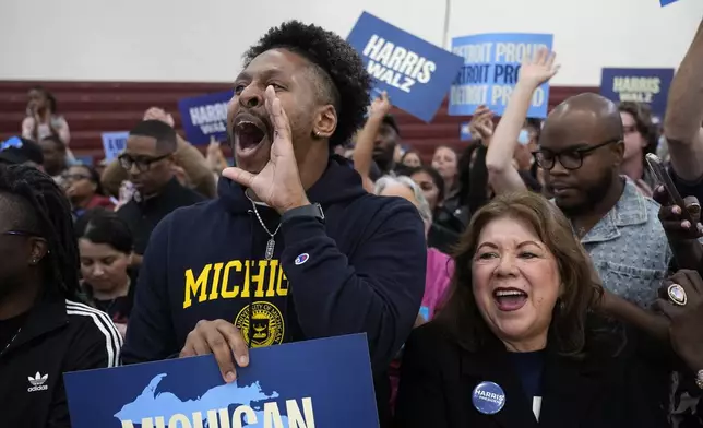 Supporters watch as Democratic presidential nominee Vice President Kamala Harris speaks during a campaign event at Western International High School in Detroit, Saturday, Oct. 19, 2024. (AP Photo/Jacquelyn Martin)