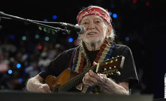 Musician Willie Nelson performing ahead of event for Democratic presidential nominee Vice President Kamala Harris at a rally in Houston, Friday, Oct. 25, 2024. (AP Photo/Susan Walsh)