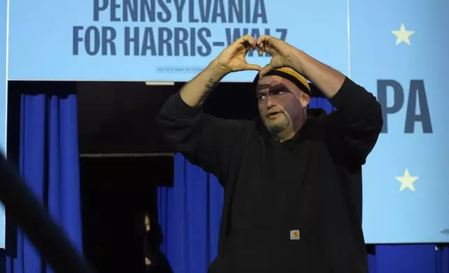 Sen. John Fetterman, D-Pa., arrives to speak at a campaign rally for Democratic presidential nominee Vice President Kamala Harris at Erie Insurance Arena, in Erie, Pa., Monday, Oct. 14, 2024. (AP Photo/Jacquelyn Martin)