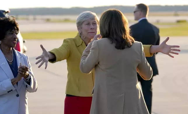 Rep. Valerie Foushee, D-N.C, from left, and Rep. Deborah Ross, D-N.C., greet Democratic presidential nominee Vice President Kamala Harris as she arrives at Raleigh-Durham International Airport in Morrisville, N.C., Saturday, Oct. 12, 2024. (AP Photo/Steve Helber)