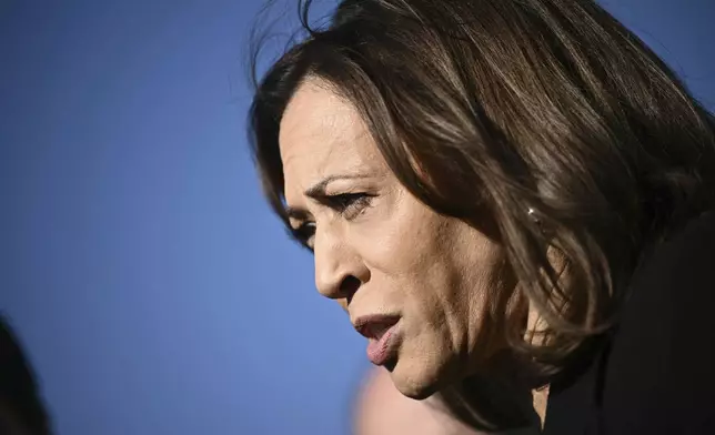 Democratic presidential nominee Vice President Kamala Harris talks to reporters before boarding Air Force Two, Wednesday, Oct. 30, 2024, at Joint Base Andrews, Md. (Brendan Smialowski/Pool via AP)