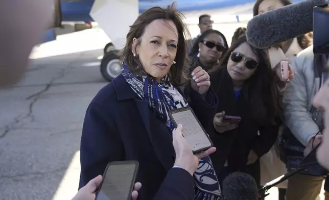 Democratic presidential nominee Vice President Kamala Harris speaks to the media before boarding Air Force Two on departure from Detroit, at Detroit Metropolitan Wayne County Airport, Wednesday, Oct. 16, 2024. (AP Photo/Jacquelyn Martin)