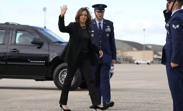 Democratic presidential nominee Vice President Kamala Harris waves as she arrives to board Air Force Two at Joint Base Andrews, Md., Monday, Oct. 14, 2024, en route to Pennsylvania. (AP Photo/Jacquelyn Martin)