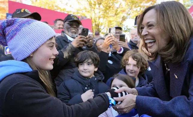 Democratic presidential nominee Vice President Kamala Harris greets people at a campaign event at Washington Crossing Historic Park, Wednesday, Oct. 16, 2024, in Washington Crossing, Pa. (AP Photo/Jacquelyn Martin)