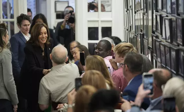 Democratic presidential nominee Vice President Kamala Harris speaks to patrons at a campaign stop at Famous 4th Street Delicatessen in Philadelphia, Wednesday, Oct. 23, 2024. (AP Photo/Matt Rourke)