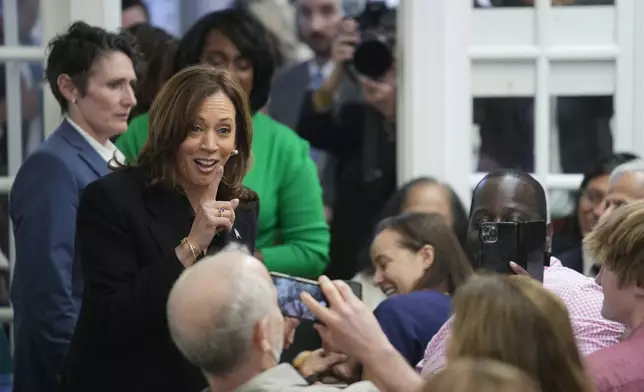 Democratic presidential nominee Vice President Kamala Harris speaks to patrons at a campaign stop at Famous 4th Street Delicatessen in Philadelphia, Wednesday, Oct. 23, 2024. (AP Photo/Matt Rourke)