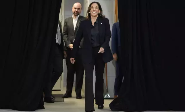 Democratic presidential nominee Vice President Kamala Harris arrives to speak during an event at the Redford Township Fire Department North Station in Redford Township, Mich., Friday, Oct. 4, 2024. (AP Photo/Mark Schiefelbein)