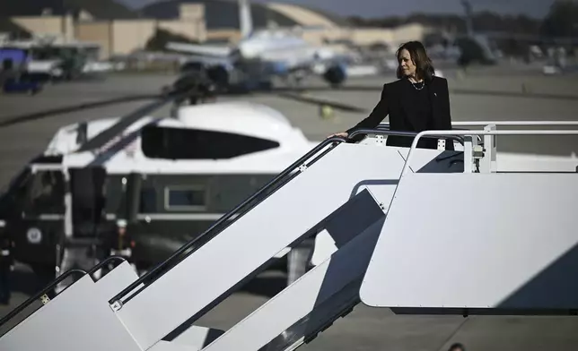 Democratic presidential nominee Vice President Kamala Harris boards Air Force Two, Wednesday, Oct. 30, 2024, at Joint Base Andrews, Md. (Brendan Smialowski/Pool via AP)