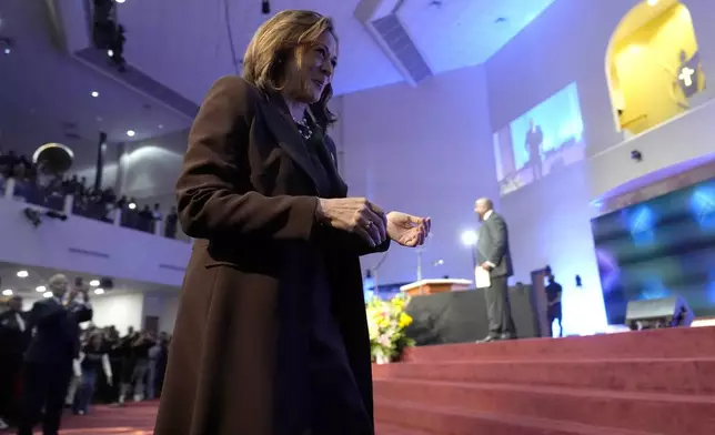 Democratic presidential nominee Vice President Kamala Harris walks to speak during a service at the Church of Christian Compassion, Sunday, Oct. 27, 2024, in Philadelphia. (AP Photo/Susan Walsh)