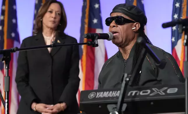 Democratic presidential nominee Vice President Kamala Harris looks on as Stevie Wonder sings "Happy Birthday" to Harris during a church service and early vote event at Divine Faith Ministries International, Sunday, Oct. 20, 2024, in Jonesboro, Ga. (AP Photo/Jacquelyn Martin)