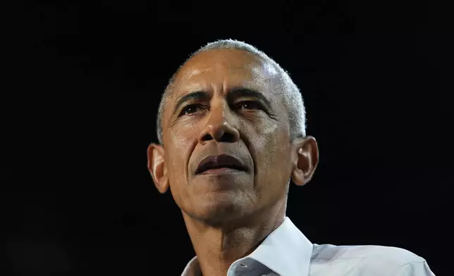 Former President Barack Obama looks on at a campaign rally supporting Democratic presidential nominee Vice President Kamala Harris, Tuesday, Oct. 22, 2024, in Detroit. (AP Photo/Paul Sancya)