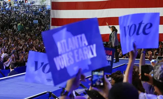 Democratic presidential nominee Vice President Kamala Harris waves as she arrives to speak at a campaign event at Lakewood Amphitheatre, Saturday, Oct. 19, 2024, in Atlanta. (AP Photo/Jacquelyn Martin)