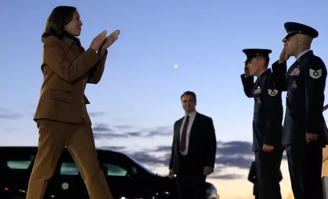 Democratic presidential nominee Vice President Kamala Harris walks to board Air Force Two at Kellogg Regional Airport, in Battle Creek, Mich., Saturday, Oct. 26, 2024. (AP Photo/Jacquelyn Martin)