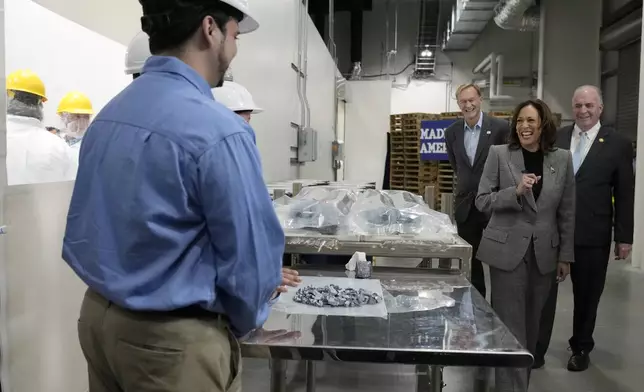 Rep. Dan Kildee, D-Mich., from right, Democratic presidential nominee Vice President Kamala Harris and Corning Chairman and CEO Wendell Weeks arrive to tour the Hemlock Semiconductor Next-Generation Finishing facility in Hemlock, Mich., Monday, Oct. 28, 2024. (AP Photo/Jacquelyn Martin)