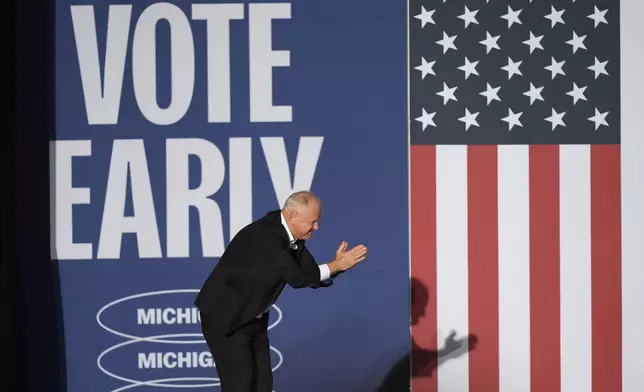 Democratic vice presidential nominee Minnesota Gov. Tim Walz arrives to speak during a campaign rally at Burns Park in Ann Arbor, Mich., Monday, Oct. 28, 2024. (AP Photo/Carlos Osorio)