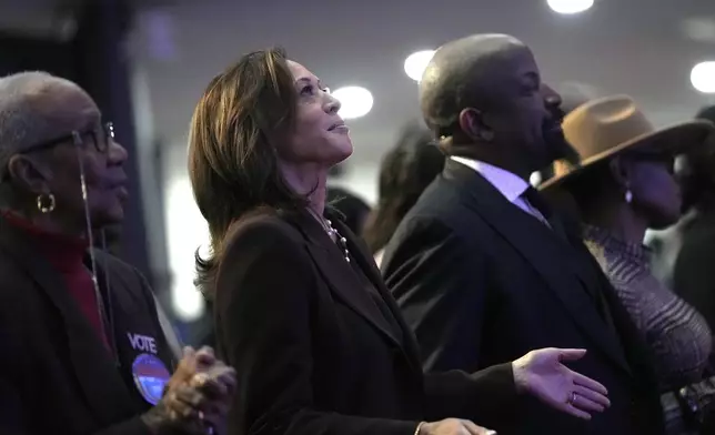 Democratic presidential nominee Vice President Kamala Harris, second left, attends a service at the Church of Christian Compassion, Sunday, Oct. 27, 2024, in Philadelphia. (AP Photo/Susan Walsh)