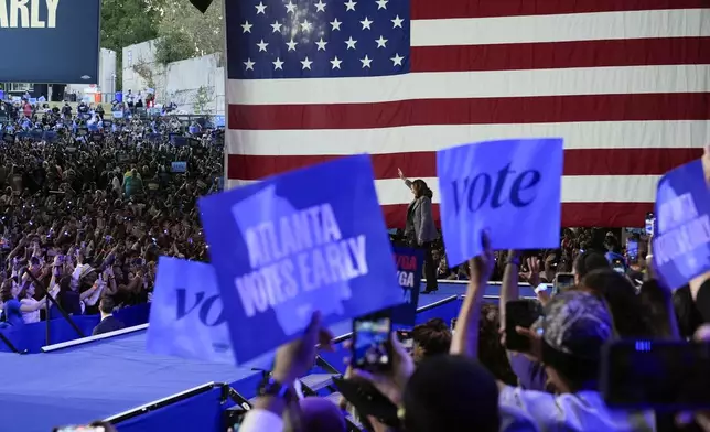 Democratic presidential nominee Vice President Kamala Harris waves to the crowd as she arrives to speak at a campaign event at Lakewood Amphitheatre, Saturday, Oct. 19, 2024, in Atlanta. (AP Photo/Jacquelyn Martin)