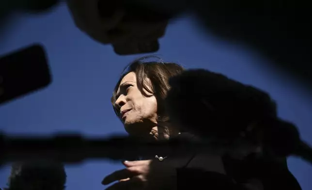 Democratic presidential nominee Vice President Kamala Harris talks to reporters before boarding Air Force Two, Wednesday, Oct. 30, 2024, at Joint Base Andrews, Md. (Brendan Smialowski/Pool via AP)