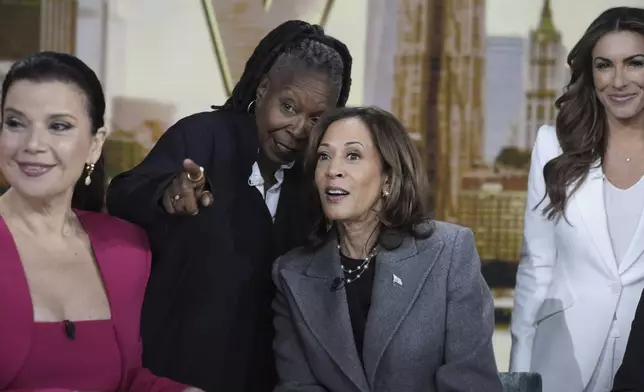 Democratic presidential nominee Vice President Kamala Harris chats with the hosts during a commercial break at The View, Tuesday, Oct. 8, 2024, in New York. From left are Ana Navarro, Whoopi Goldberg, Harris and Alyssa Farah Griffin. (AP Photo/Jacquelyn Martin)