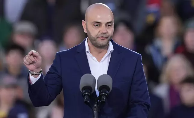 Assad Turfe, of Dearborn, Mich., speaks at a campaign rally for Democratic presidential nominee Vice President Kamala Harris at Burns Park in Ann Arbor, Mich., Monday, Oct. 28, 2024. (AP Photo/Carlos Osorio)